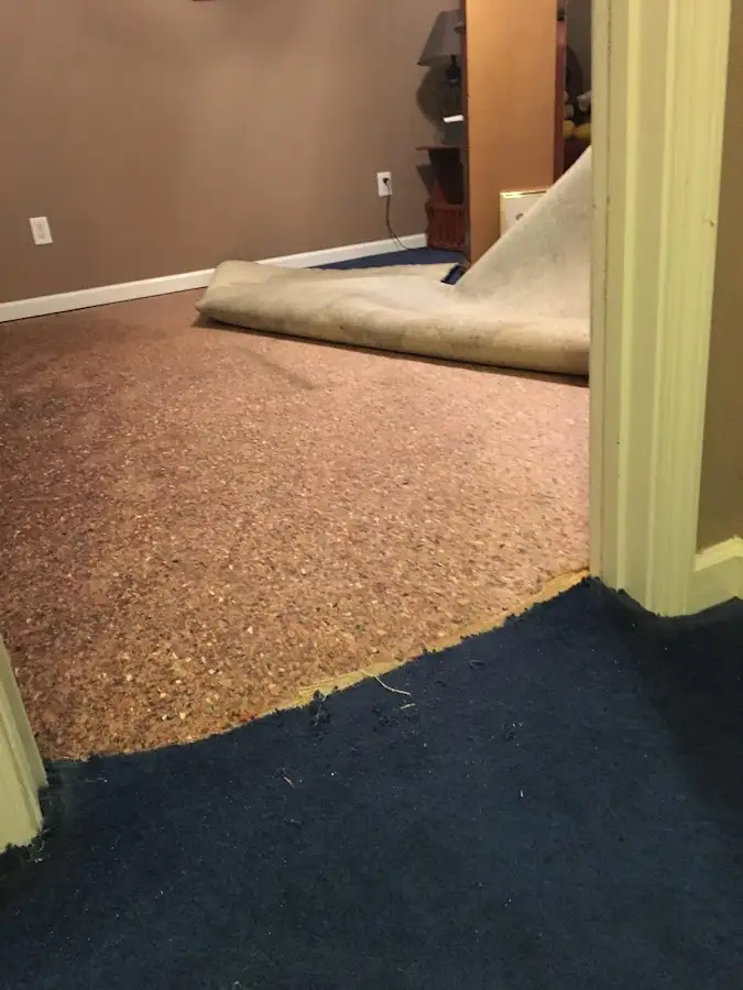 Carpet pad removal revealing water damage during Drying & Dehumidification in Gustine